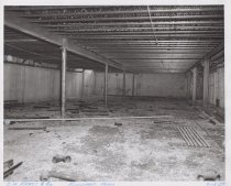 Black and white photograph of Kress construction site with the frame being