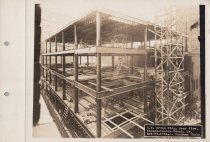 Black and white photograph of Kress construction site with frame being cons