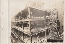 Black and white photograph of Kress construction site with frame being cons