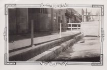 Black and white photograph of the side of an unknown building