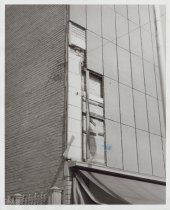 Black and white photograph of Kress wall with damage