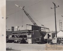 Black and white photograph of Kress construction site with the frame being