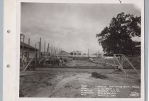 Black and white photograph of Kress construction site with the lot being cl