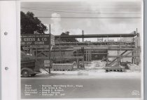 Black and white photograph of Kress construction site with the frame being