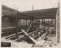 Black and white photograph of Kress construction site with frame being cons