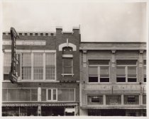 Black and white view of building store front