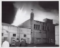 Black and white photograph of Kress store on fire