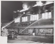 Black and white photograph of Kress store on fire