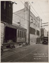 Black and white photograph of Kress back alley