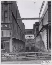 Black and white photograph of Kress side alley under construction