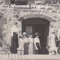 Stone annex building in Basin with ladies.