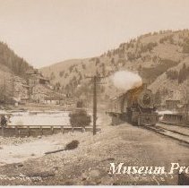 Postcard of Great Northenr train in Basin, Montana.