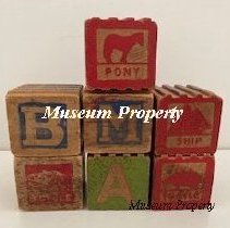 Alphabet blocks with letters and pictures.