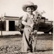 Douglas Marks in ranch house yard.