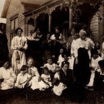 Women and children in front of Clancy Methodist Parsonage.
