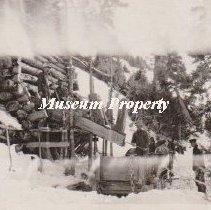 Gray Eagle Mine of men drawing ore from bins.