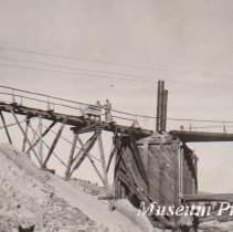 Two with ore car at Comet Mine.