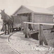 Horse drawn tram car over bin at Comet.