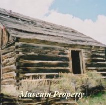 Log cabin and shed in Comet, Montana.