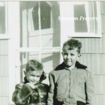Bob and Dick Haab in front of their house.