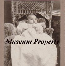 Baby in wicker chair