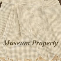 Light brown and white checked apron