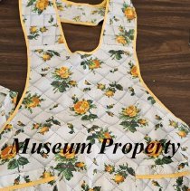 White apron with yellow roses
