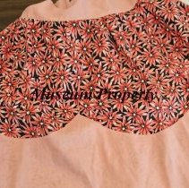 Pink apron with pink flowers and black background