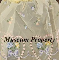 Yellow apron with pink and blue flowers