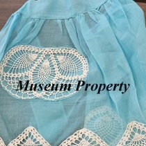 Aqua colored apron with white laced pockets