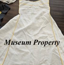 White apron with yellow trim