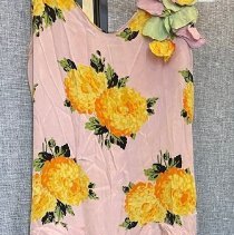 Pink sleeveless dress with yellow flowers