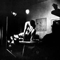 Figure Kneeling on Table