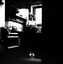 Figure in Pink Kitchen