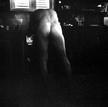 Figure Leaning on a Stove