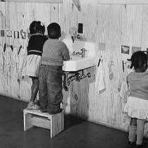 Cleaning up before hot lunch is served, Okeechobee Migratory Labor Camp, Be