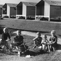 Children of Migrant Packing House Workers in Front of Metal Shelters