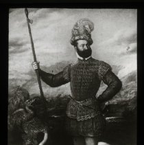 Man with a sword (?), dog next to him, baby angle with dragon.