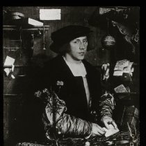 Image of a man with a hat with a note in his hand.