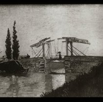 Image of a bridge over a river. Woman walking across.
