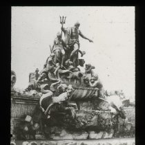 Sculpture with many men. One men has big sword and pointing.