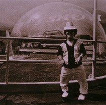 The People of America (man infront of car under dome)