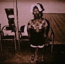 The People of America (woman in white feathered cap)