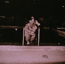 The People of America (little woman climbing out of swimming pool)