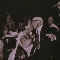 The People of America (woman kissing man)