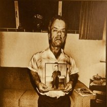 The People of America (man holding portrait )