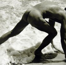 Robert running away from wave on beach