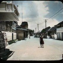 Woman walks in center of street