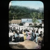 Women kneeling outdoors