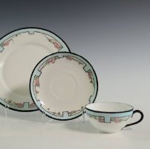 Hand-Decorated Cup and Saucer Featuring a Stylized Border and Roses
